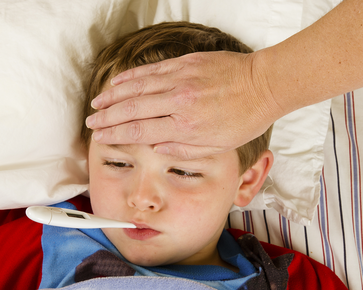 sick-child-boy-being-checked-for-fever-and-illness-while-resting